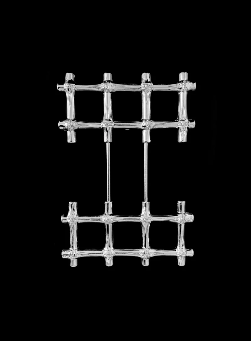 A vintage silver plated trivet