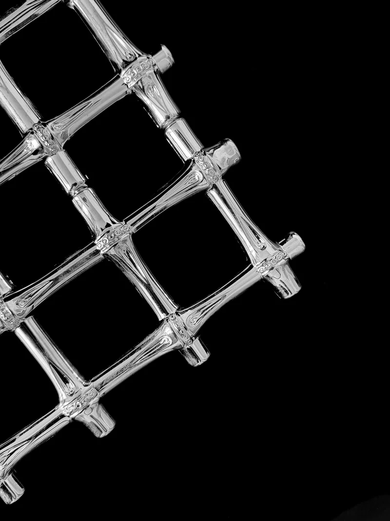 A vintage silver plated trivet