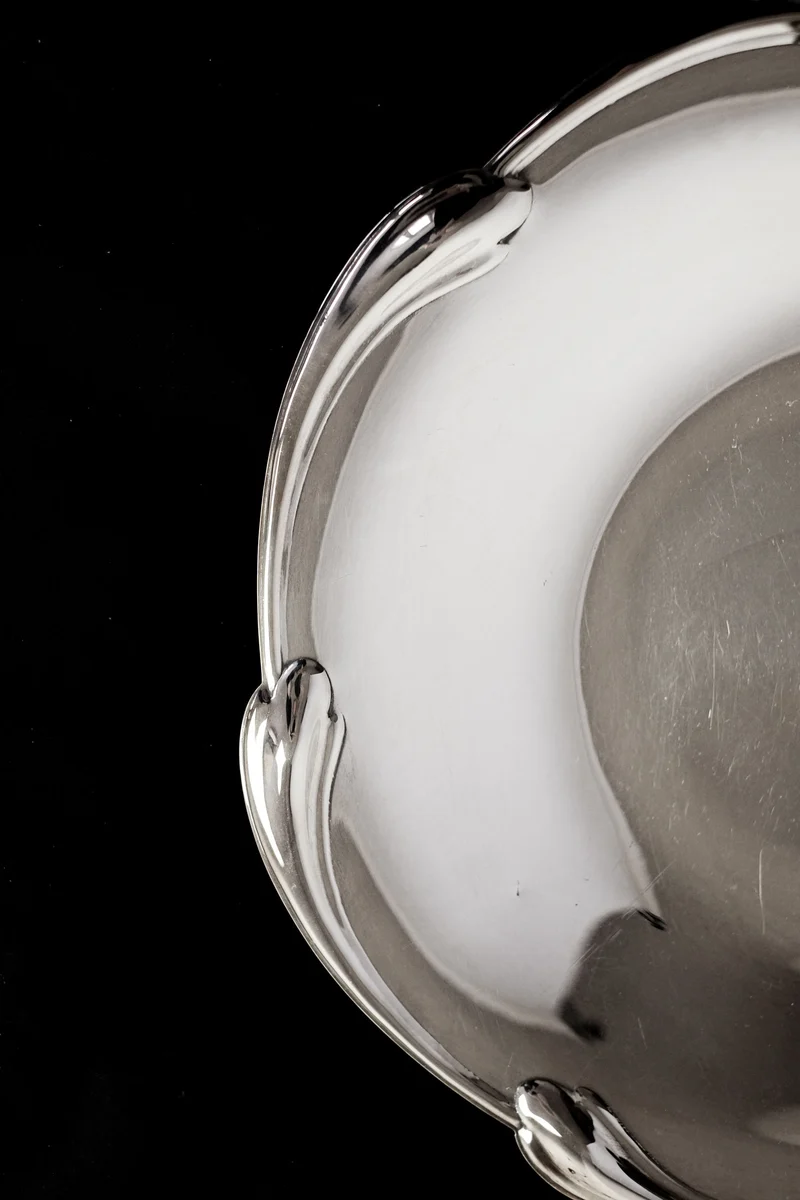 Large silver-plated dish with scaled rim