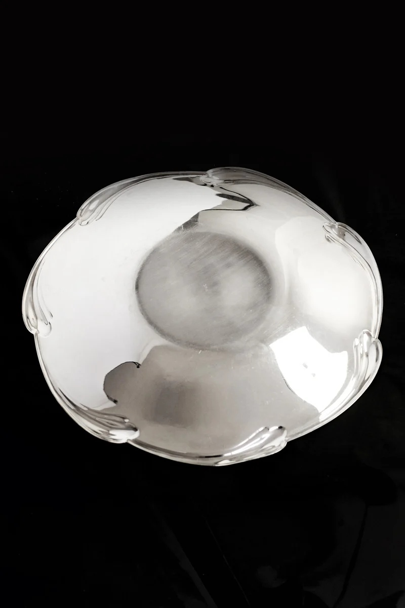 Large silver-plated dish with scaled rim