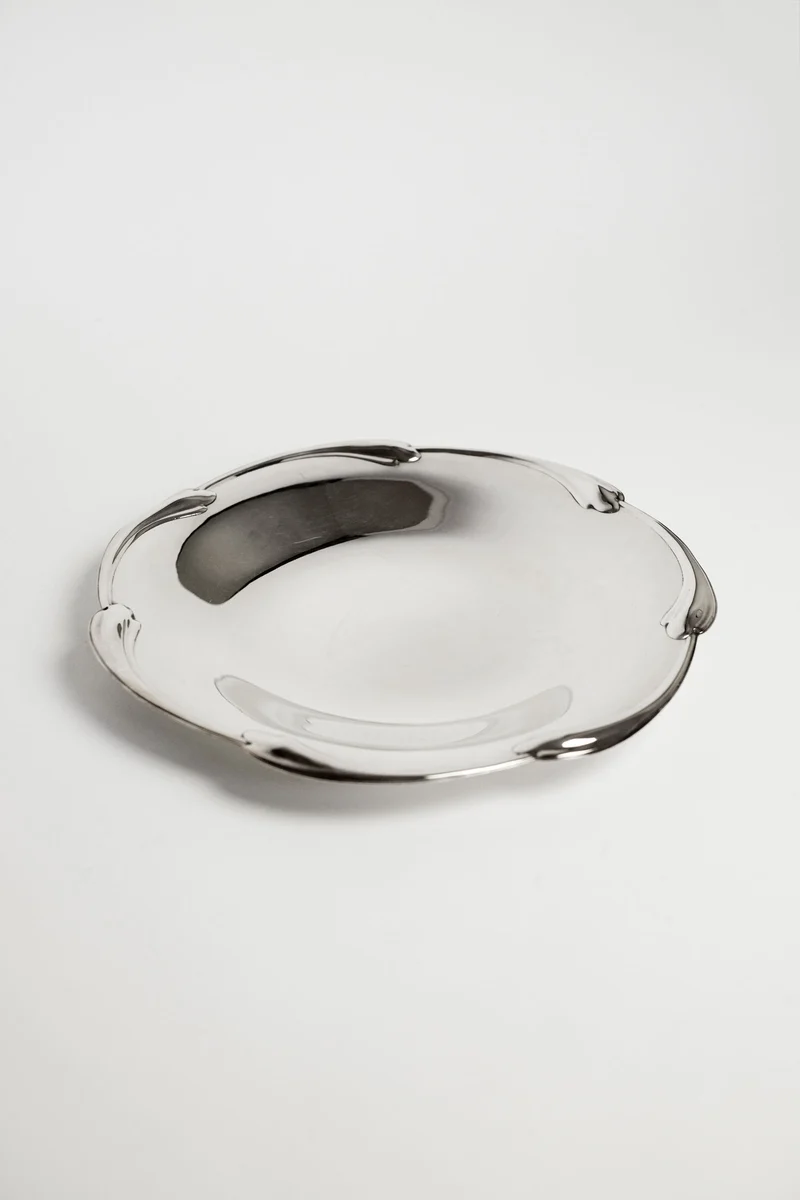 Large silver-plated dish with scaled rim