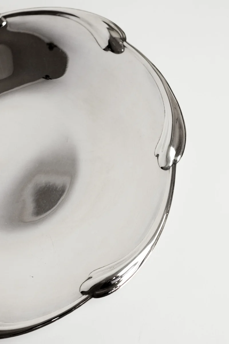 Large silver-plated dish with scaled rim