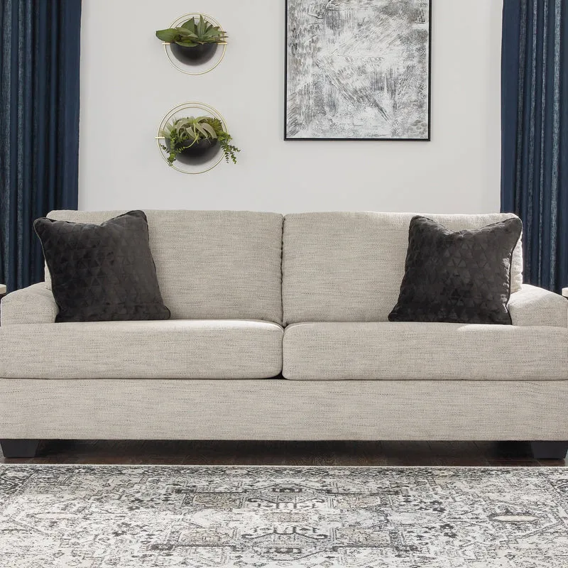 Sofa condo en tissu beige pâle avec coussins - Vayda