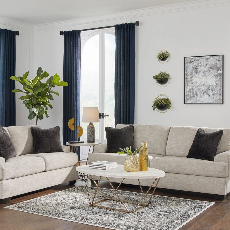Sofa condo en tissu beige pâle avec coussins - Vayda