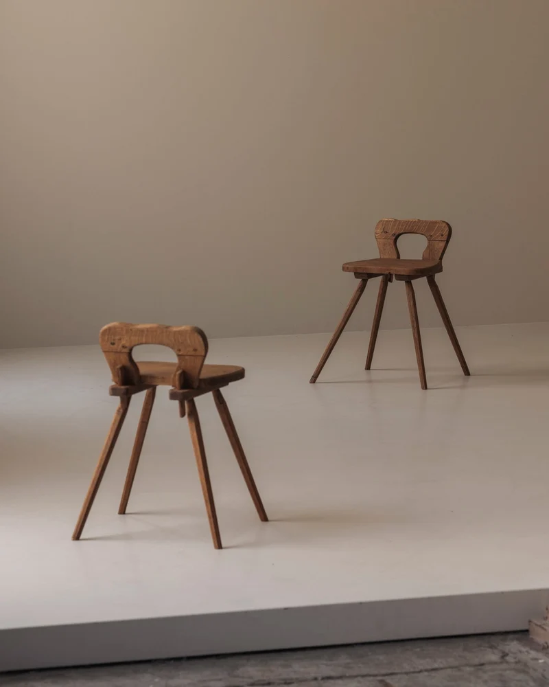 Sculptural pair of French solid oak side chairs from the 1950s