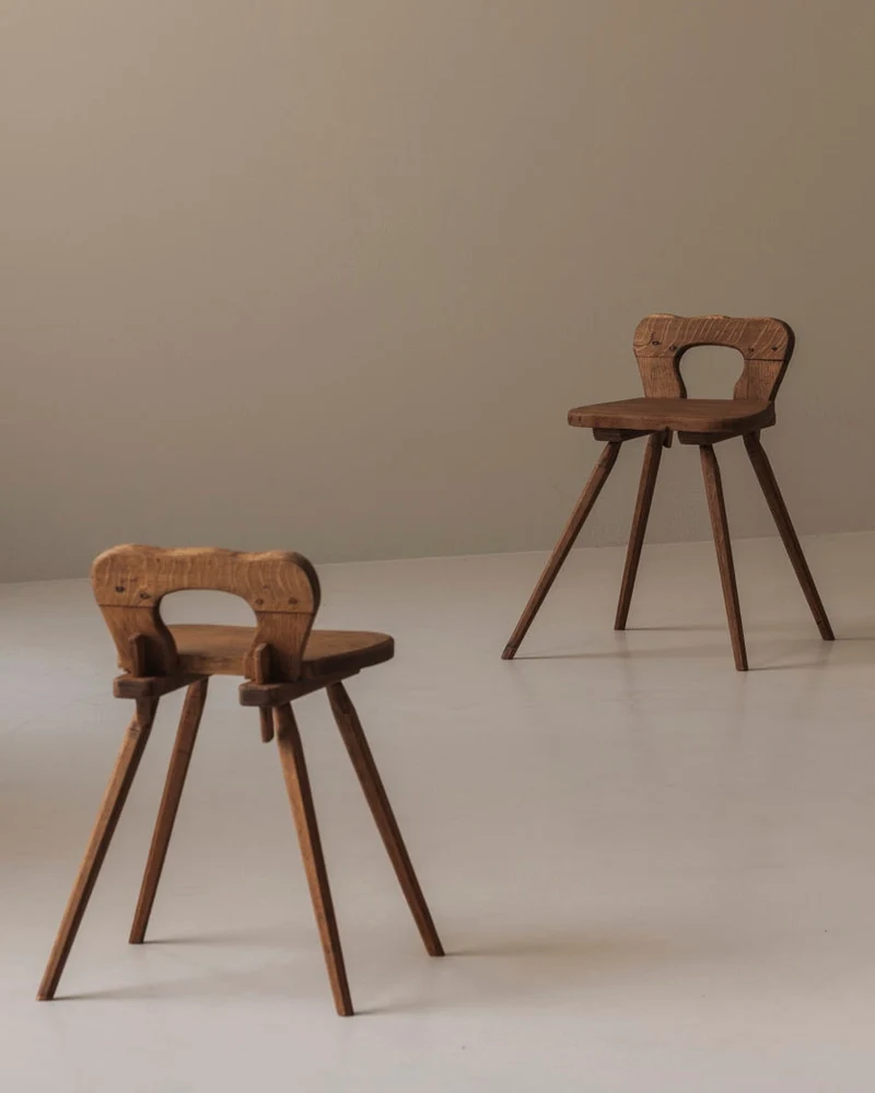 Sculptural pair of French solid oak side chairs from the 1950s