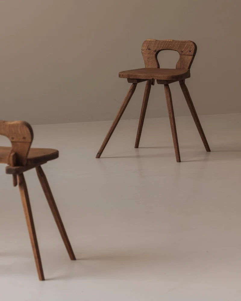 Sculptural pair of French solid oak side chairs from the 1950s