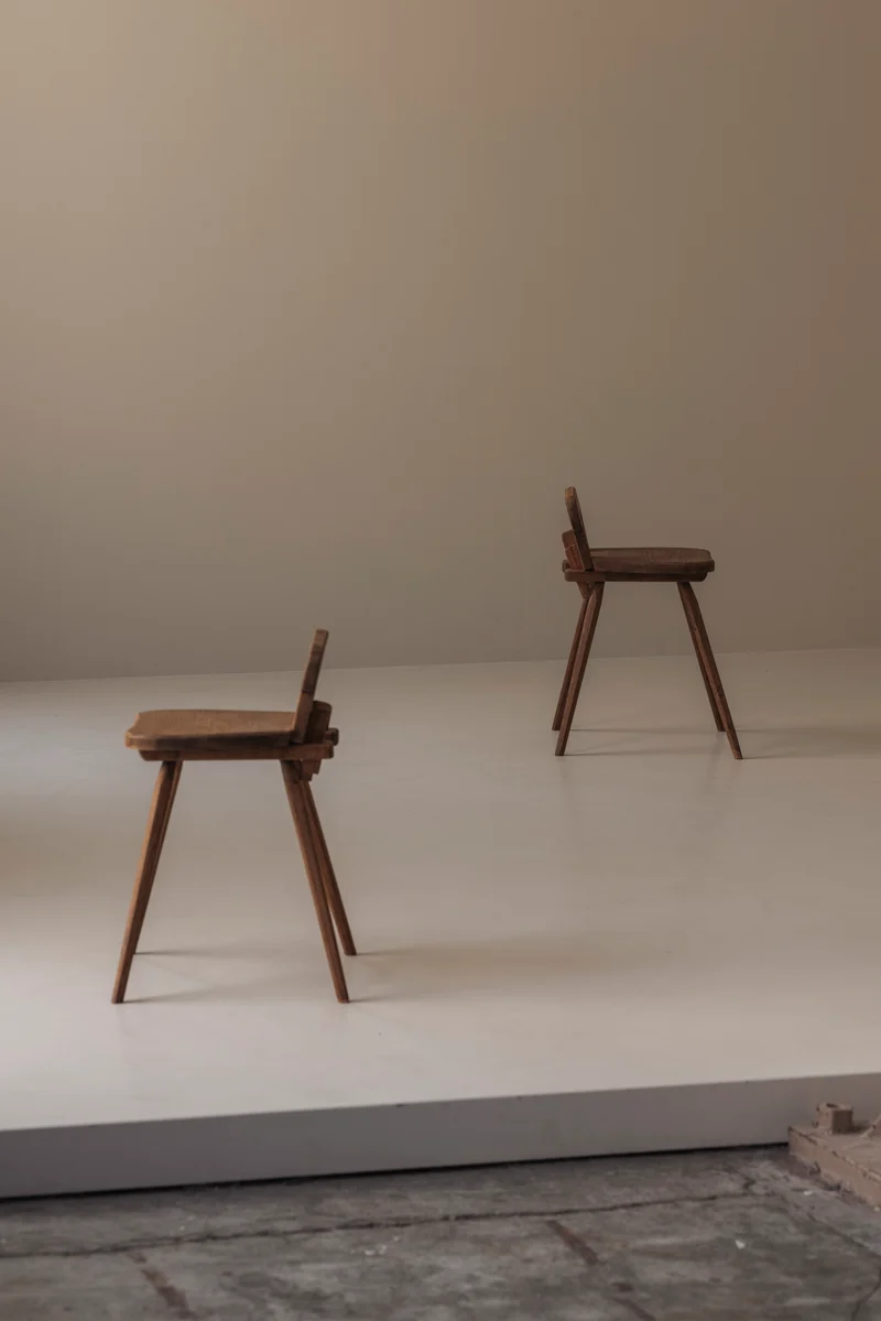 Sculptural pair of French solid oak side chairs from the 1950s