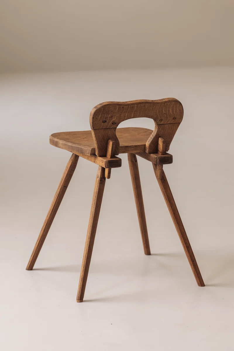Sculptural pair of French solid oak side chairs from the 1950s