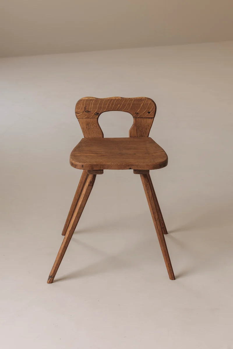 Sculptural pair of French solid oak side chairs from the 1950s