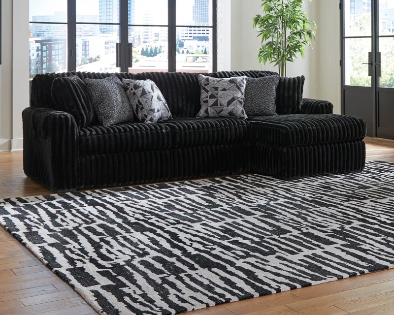 Sofa en velours côtelé noir avec chaise longue & coussins - Gabbyleigh
