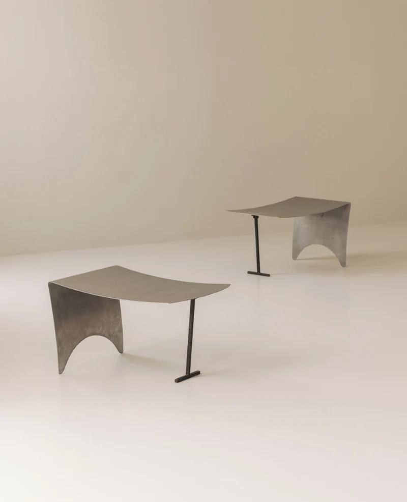 A striking set Modernist curved metal stools from France, dating to the 1980s.