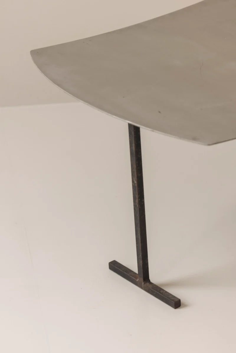 A striking set Modernist curved metal stools from France, dating to the 1980s.