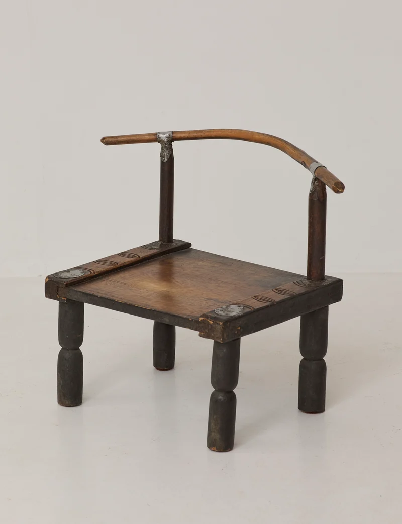 Small artisanal vintage West African chair "Baoulé" in solid wood C. 1960