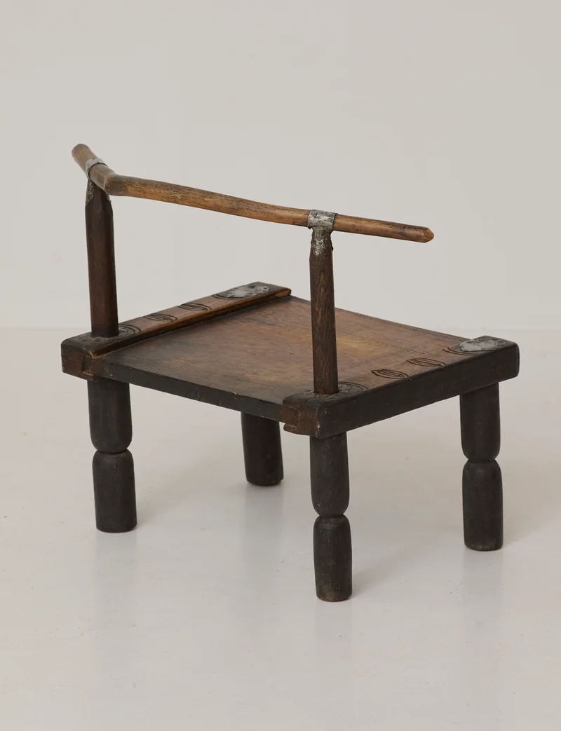 Small artisanal vintage West African chair "Baoulé" in solid wood C. 1960