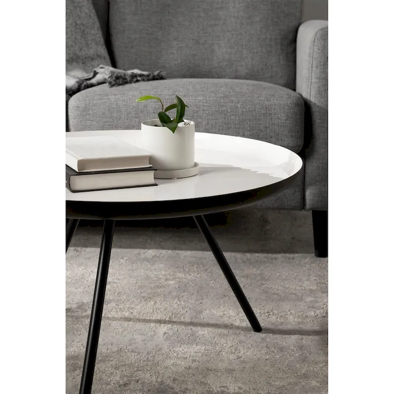 Table basse ronde en métal avec pieds trépied et finition émail bicolore blanc et noir