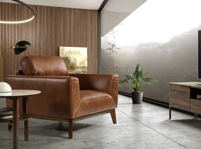 Fauteuil en cuir marron et pied en bois Angel Cerda