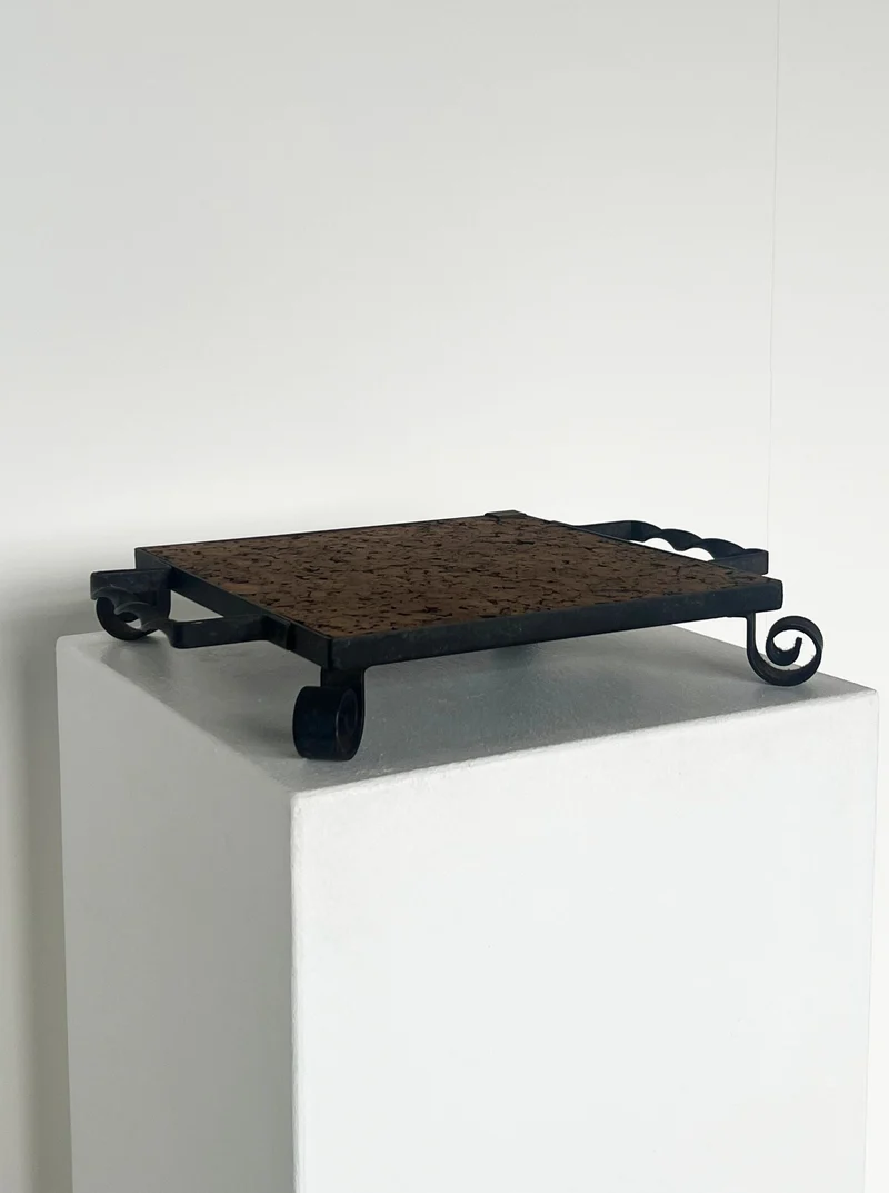 Cork and cast iron display plate