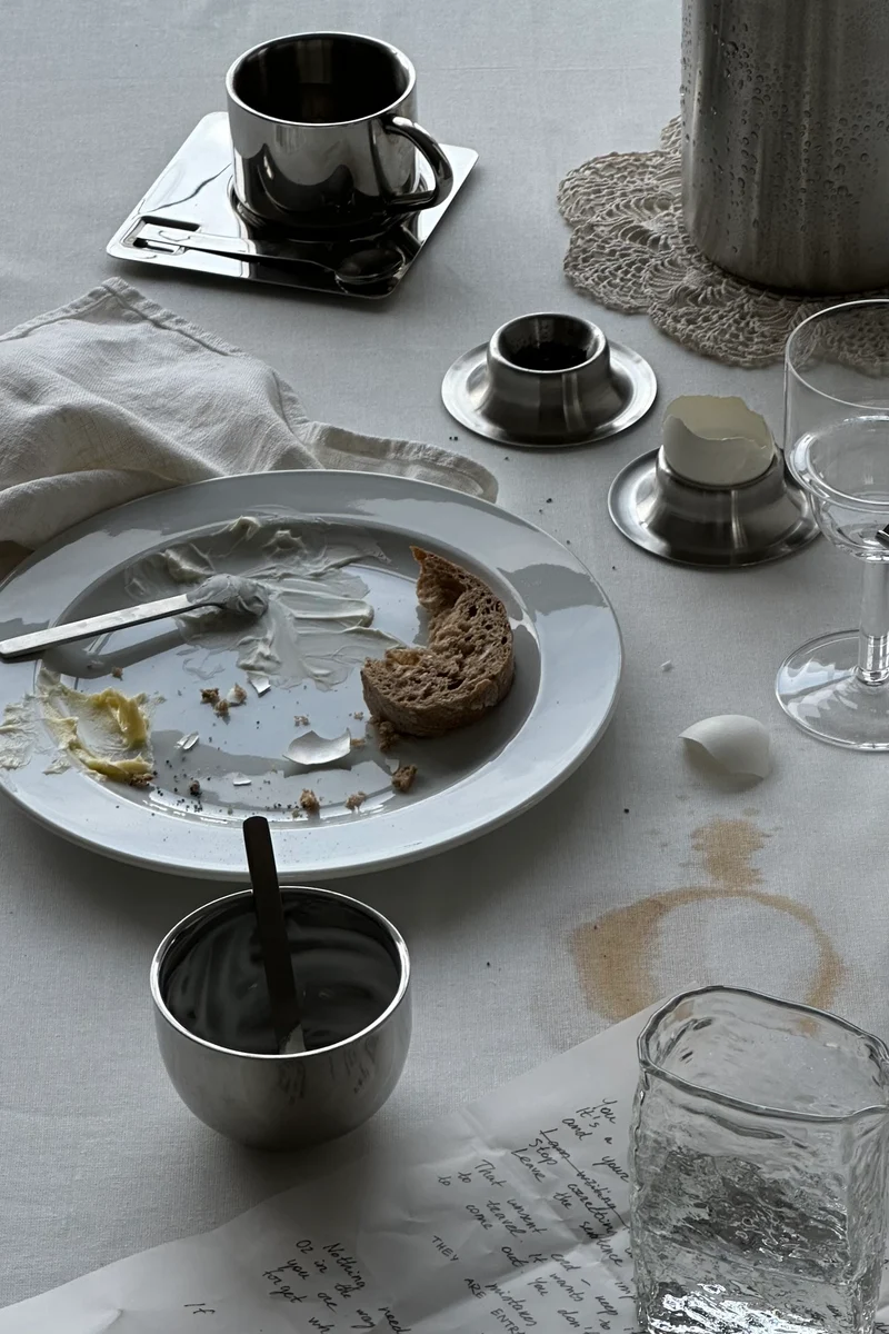 'HEDONISM' stainless steel cup with saucer