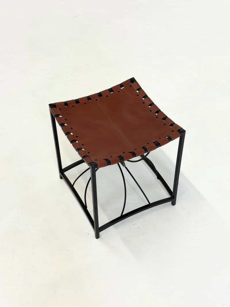 Elegant vintage French stool with black metal and brown leather