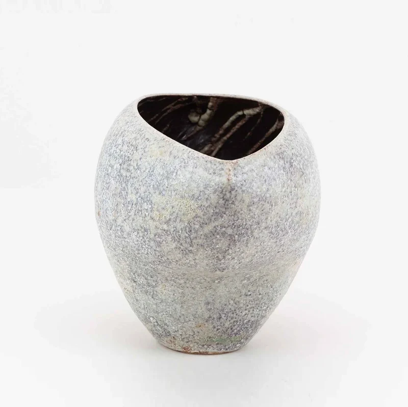 A Cloven Stoneware Bowl in Lilac and Grey Glaze by Chris Carter (B. 1945)