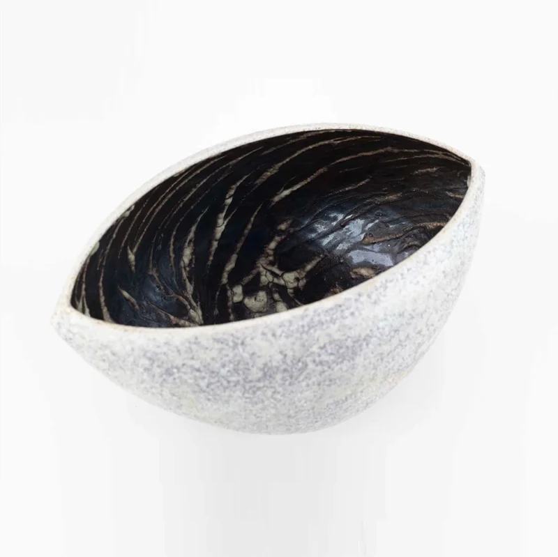 A Cloven Stoneware Bowl in Lilac and Grey Glaze by Chris Carter (B. 1945)