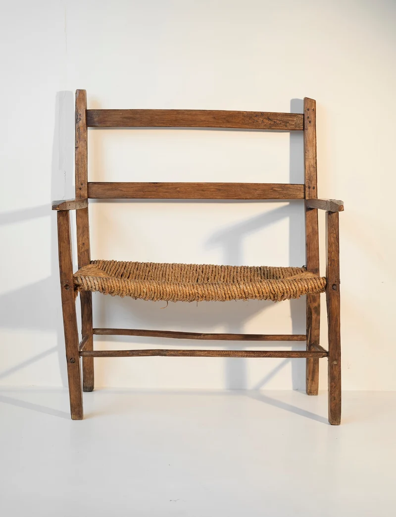 A French folk bench from the 19th Century. Wood and straw