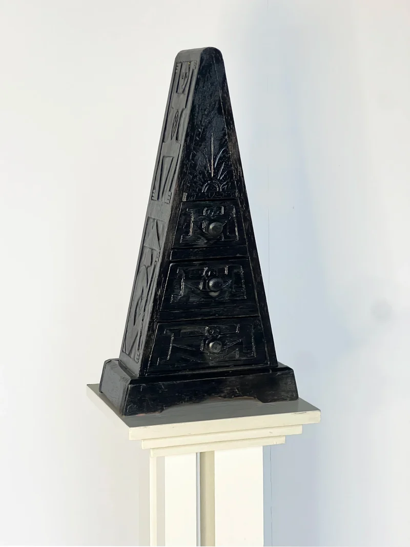 Triangle small chest of carved drawers